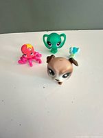 Group shot showing three of the Littlest Pet Shop figures