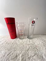 All three promotional glasses standing side by side