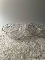 Both cut glass bowls side by side