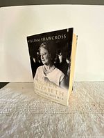 Front angled view of paperback book