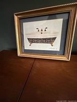 Full view of signed bathtub print in gold frame