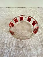 Top view showing red striped rim and three rests
