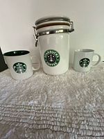 Full view of canister and two mugs