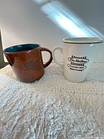 Front view of both Tim Hortons mugs