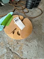 Top view of circular MDF dog treat puzzle spinner with cut-outs