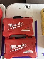 Two closed red Milwaukee bit cases stacked