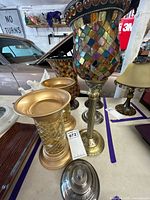 Mixed set of PartyLite mosaic vases and candle holders on table