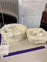 Both PartyLite resin pieces side by side on table