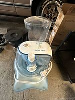 Front view of Rival ice cream maker, with coffee maker and beverage dispenser partially visible