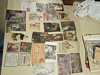 Top-down view of entire group of postcards spread on table