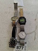 Overview of four Timex watches in lot