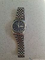 Full view of Pulsar watch showing bracelet and dial