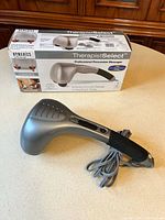 Massager side view with box behind