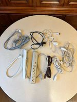 All cords and power strips laid out on round table