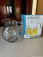 Pitcher beside its Dailyware retail box