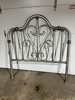 front view of brushed nickel metal headboard