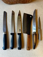 All six knives laid out blades up