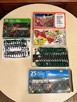 All three boxed light sets with trays visible