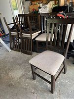 Six dark brown wood dining chairs, beige seats