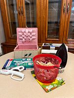 Full lot showing sewing basket open, iron with box, clothespins basket, Singer scissors and box
