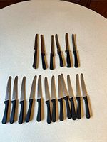 All 18 knives arranged to show quantity and two groups