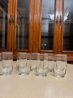Front view showing all nine matching tumblers