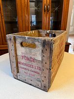 Crate angle view showing front panel with handle and branding