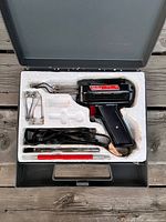 Full kit in case showing soldering gun and accessories