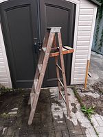 full view of wooden step ladder standing open