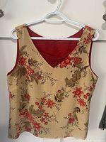 Front view of floral tank top on hanger