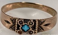 Full view of ring showing band and stone settings