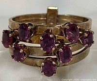 Front view showing nine rubies and split shank