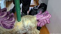 Left side of carousel horse torso, purple mane detail, green pole insertion