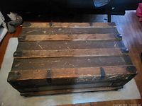 Top view of steamer trunk showing wood slats and hardware