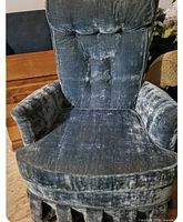 Front view showing tufted backrest, seat cushion and skirt