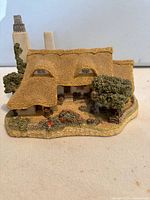 Thatched roof cottage with garden detail