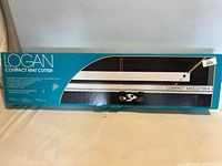Front of boxed Logan Compact Mat Cutter showing branding and product image
