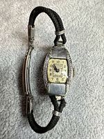 Full view of Bulova rectangular wristwatch with fabric band