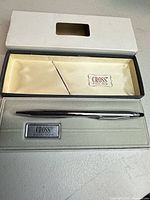 Pen with open presentation box showing interior