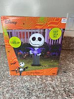 Front of box showing Jack Skellington inflatable and size