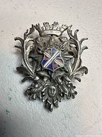 Front view showing heraldic design and enamel shield