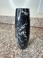 Full view of marble vase showing engraved dragon motif