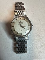 Front view of Omega Constellation showing dial, hands, and bracelet