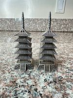Front view of both pagoda sterling shakers