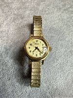 Front view showing dial, hands and date window
