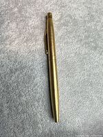 Full view of brass Sheaffer ballpoint pen