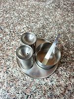 Complete condiment set on tray showing all five pieces