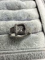 Front view showing buckle design and pavé stones