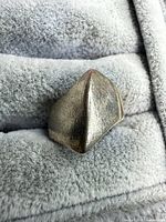 Front view of angular sterling silver signet ring