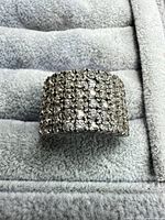 Front view of wide pave cluster ring